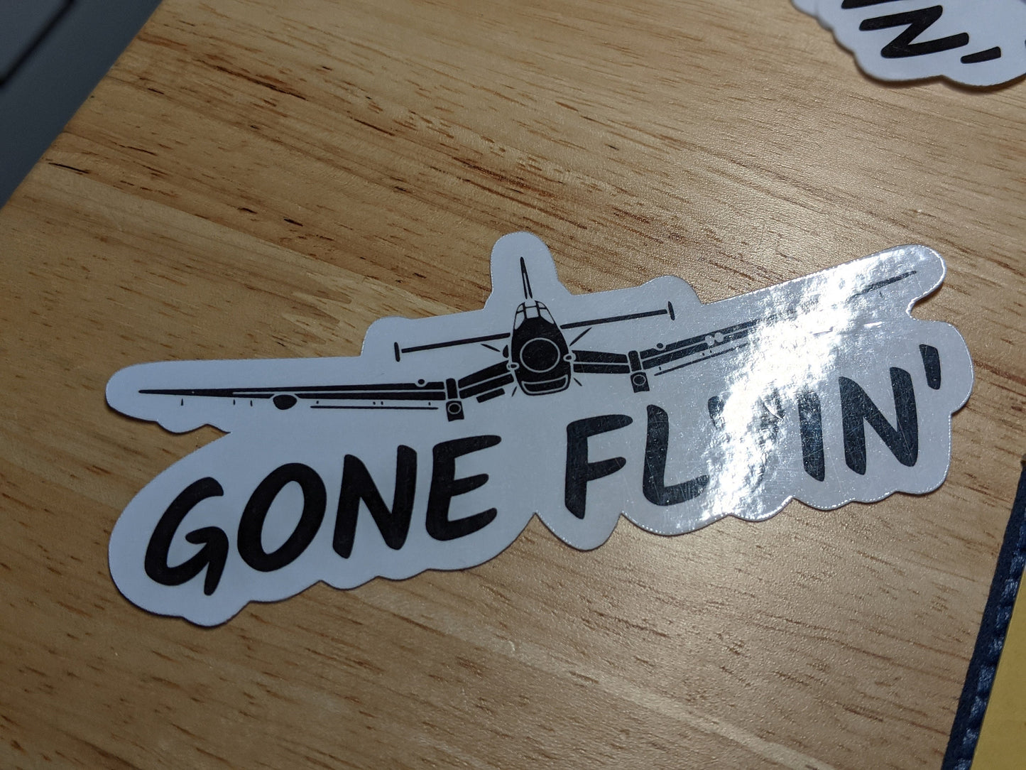 GONE FLYIN' die-cut waterproof sticker (2x5")